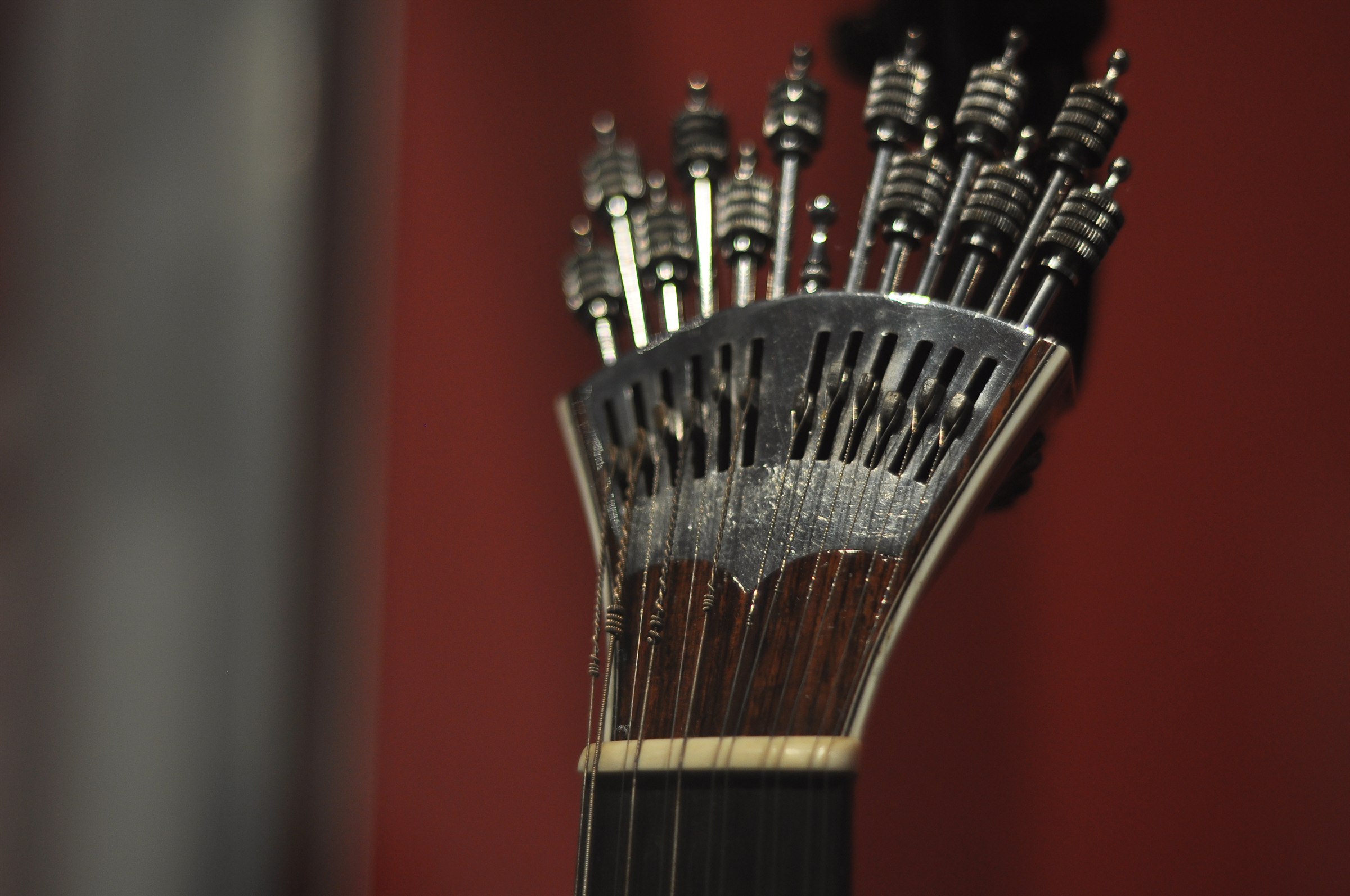 Close-up of a guitarra portuguesa headstock showing the fan-shaped preset tuning mechanism
