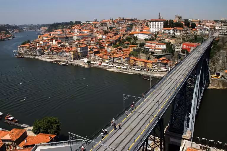 The upper deck of the Dom Luis I bridge in Porto with the Ribeira waterfront and old town across the Douro