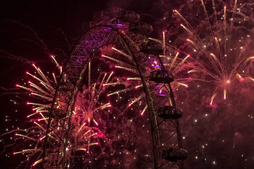 Red and gold New Year fireworks bursting around the London Eye at night