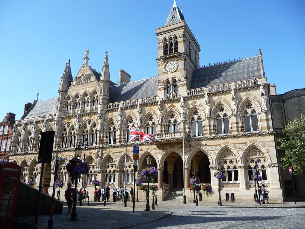 The Victorian Gothic Guildhall in Northampton with its clock tower and arched facade