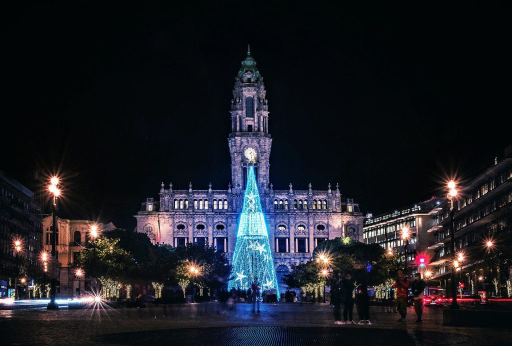 The illuminated Christmas tree in front of Porto City Hall at the top of Avenida dos Aliados at night
