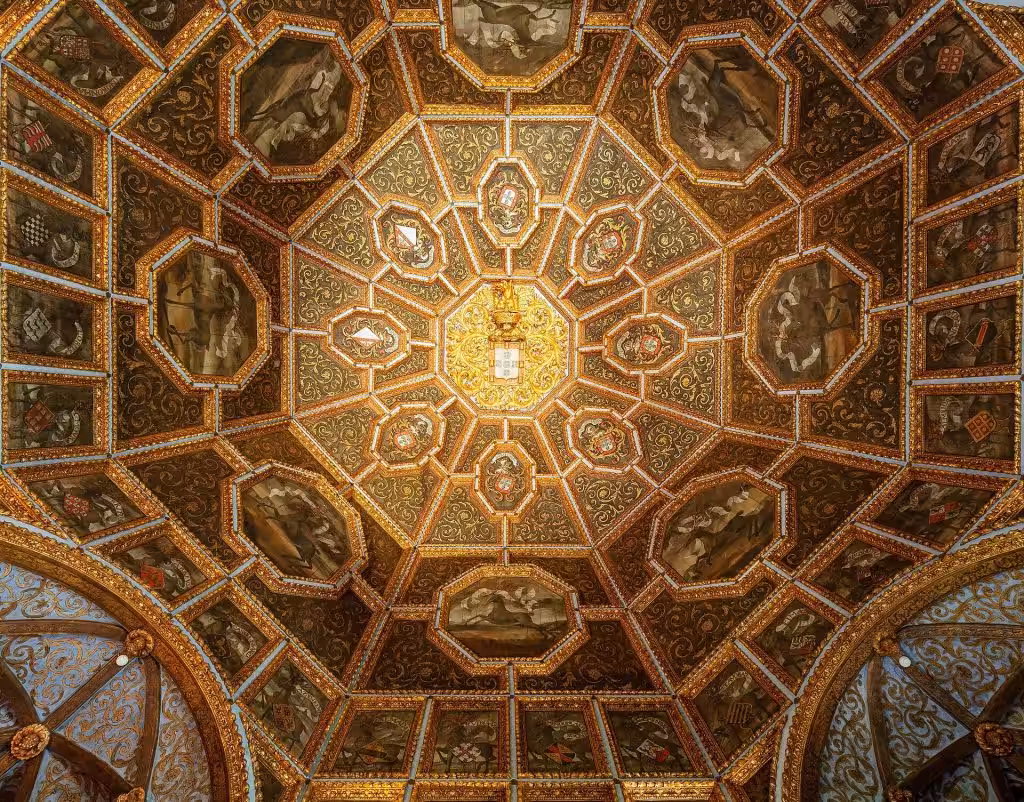The gilded octagonal ceiling of the Hall of the Coats of Arms inside the Sintra National Palace